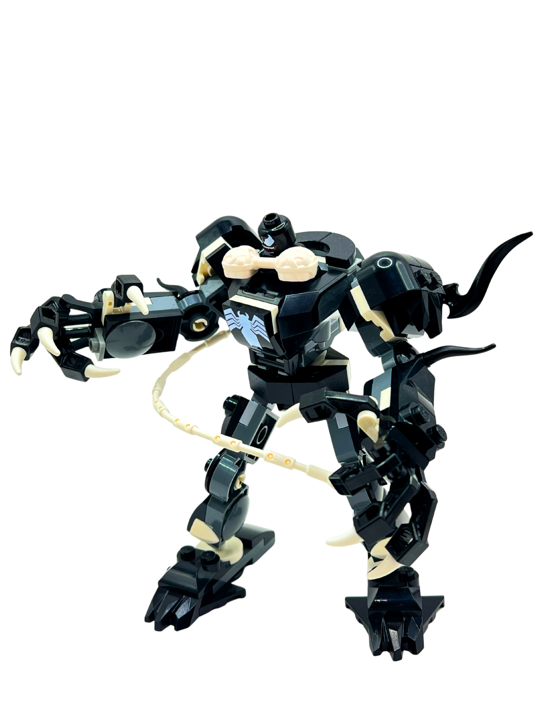 Venom mech in black with symbiote tendrils and claws